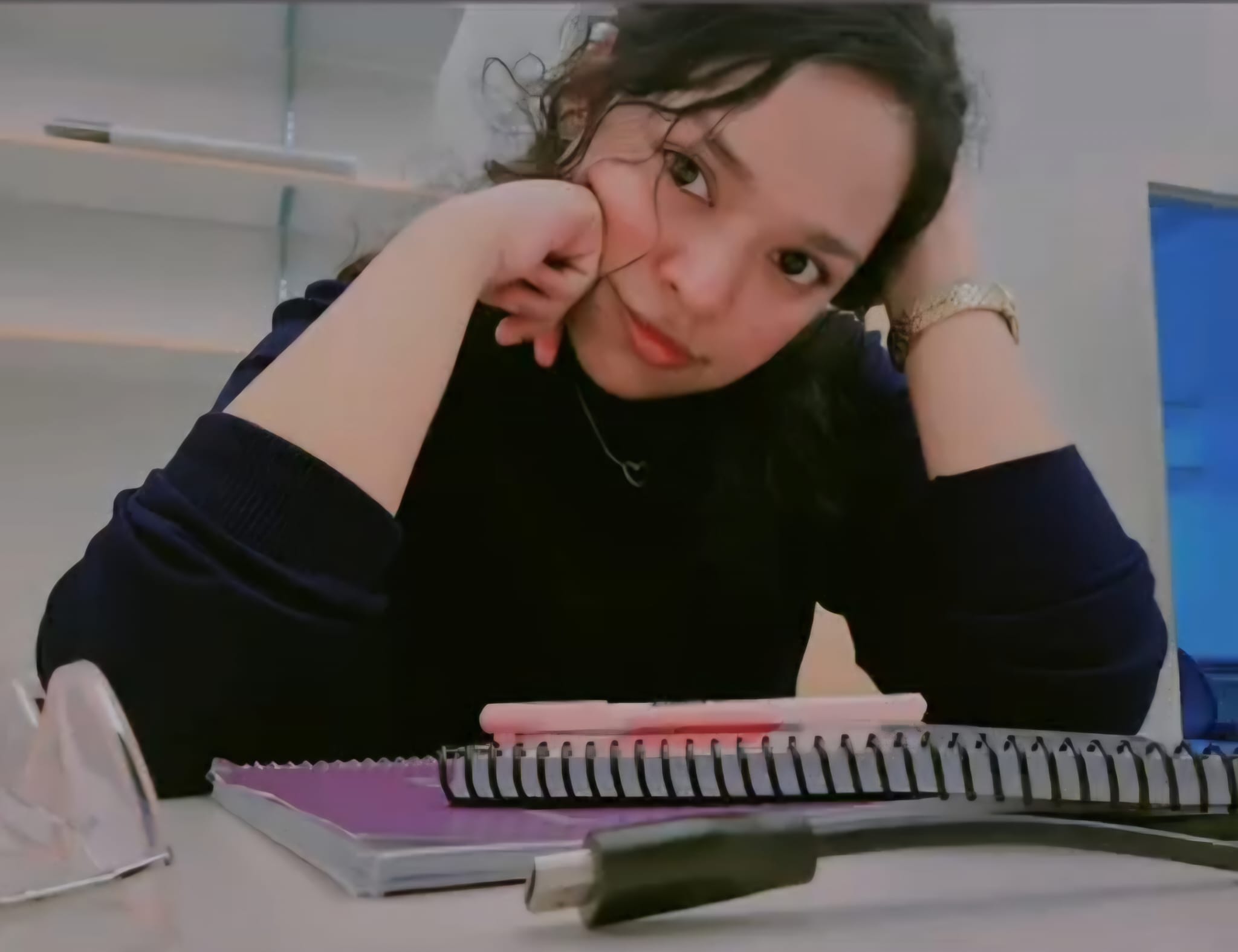 Portrait of Nidita Roy studying at a desk